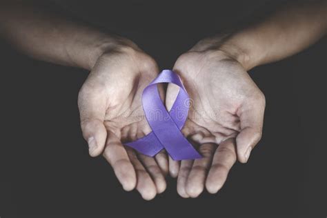 Woman Hand Holding Purple Ribbon Domestic Violence Awareness Month