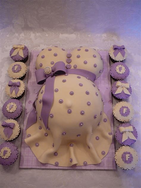 Vary the color of the fondant and add fondant clothing to personalize the maternal baked good. Pregnant Belly - CakeCentral.com