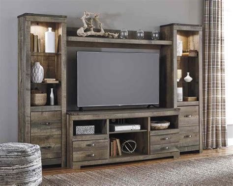 Signature Design By Ashley® Trinell 3 Piece Brown Entertainment Center