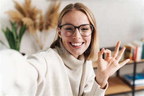 Photo Of Smiling Attractive Woman Taking Selfie And Gesturing Ok Sign