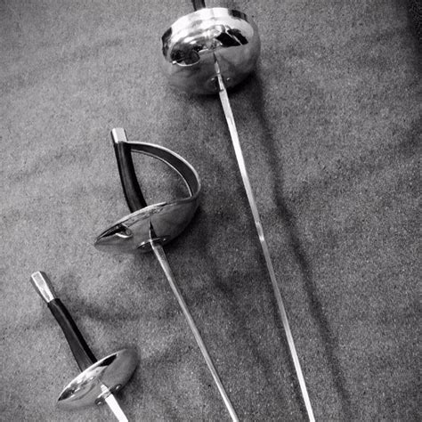 Fencing swords can often be highly customised for personal preference. #SwordsAfrerMidnight sport fencing swords left to right ...
