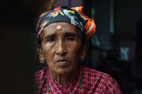 a nepali woman waits in line to be seen at a health picryl public