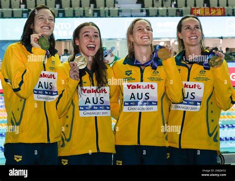 Australias Womens 4x100m Freestyle Relay Team Hold Up Their Gold Medals At The World Swimming
