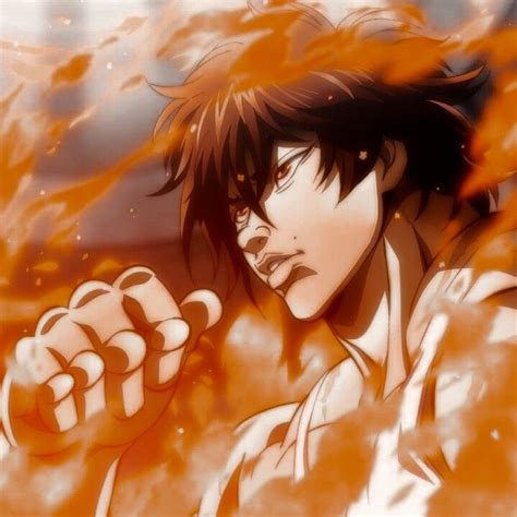 An Anime Character Holding His Fist Up In Front Of The Camera With Fire