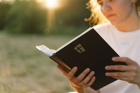 Premium Photo Christian Woman Holds Bible In Her Hands Reading The