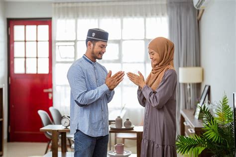 Muslim Couple Is Forgiving Each Other Putting Their Tip Of Their Finger