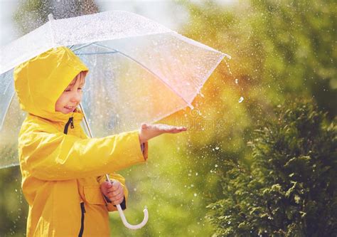 Happy Kid Catching Rain Drops In Spring Park Stock Image Image Of