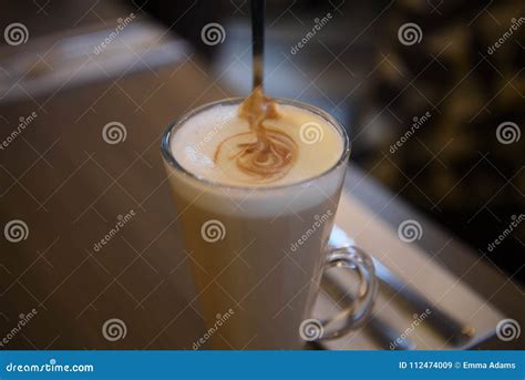Delicious Hot Frothy Coffee Latte Drink With Spoon In A Glass Cup Stock