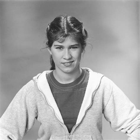 Nancy McKeon in character as Jo therefore the "dazzling smile". Alex