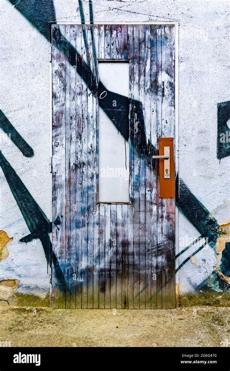 Painted Old Ugly Door Graffiti On Building Exterior Stock Photo Alamy