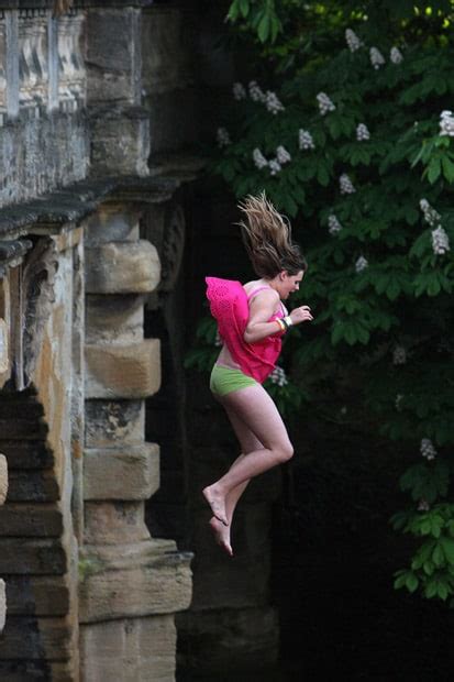 May Day Revellers Jump Off Magdalen Bridge Into The River Cherwell In