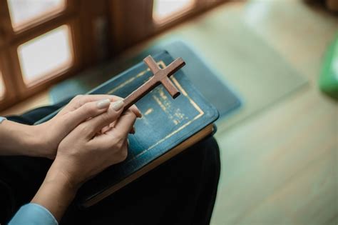 Premium Photo Hands Pray With Bible And Wooden Cross
