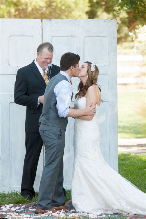 The Bride And Groom Share Their First Kiss As Newlyweds