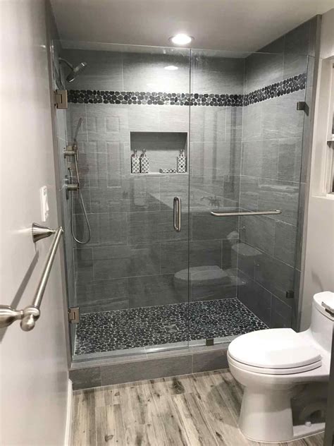 Ideas on how to use mosaic tile for borders in a bathroom. Tile Black Pebble Tile Shower Pan And Border Subway ...