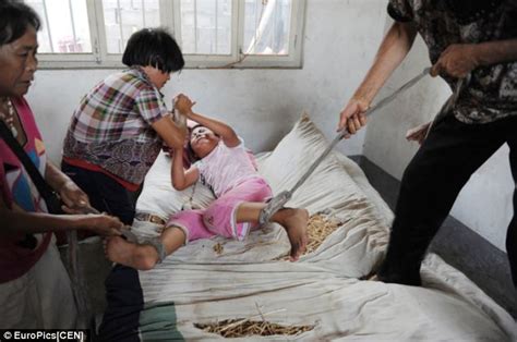 Shocking Images Of Chinese Girl Tied To Her Bed By Her Own Mother Because She Started