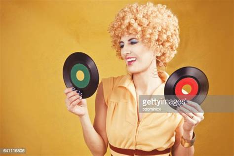 woman holding vinyl records photos and premium high res pictures getty images