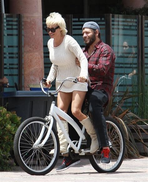 Pamela Anderson In Pamela Anderson And Rick Salomon Share A Bicycle In
