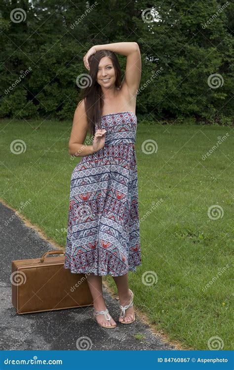 Pretty Young Woman In Sundress Standing With Suitcase Stock Image