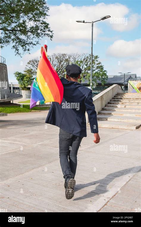 Back View Of A Gay Activist Waving A Lgbt Rainbow Flag Concept Of Pride Pride Month Stock
