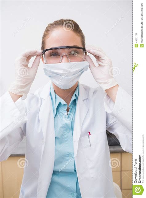 Dentist Putting On Her Protective Glasses Stock Image Image Of Front Clinic 43633777
