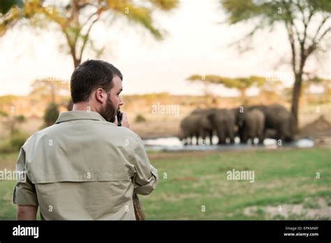 Botswana Senyati Safari Camp Man Taking Pictures Of Group Of