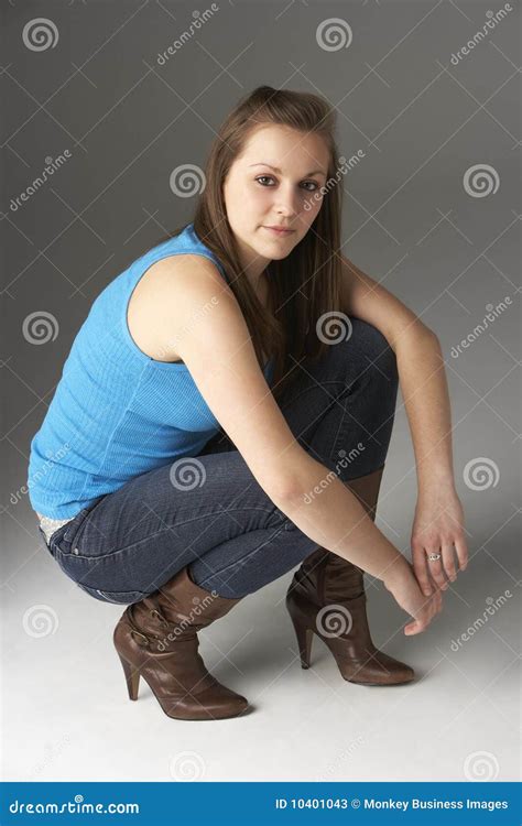 Teenage Girl Kneeling In Studio Stock Image Image Of Portrait