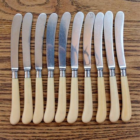 Set Of Ten Antique English Butter Knives With Solid Silver Collars