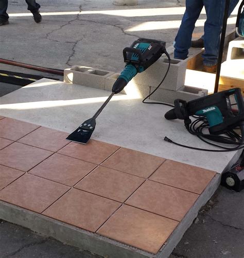 Use the hammering mode to chip up tiled floors. Demolition Hammer Tile Removal | Tile Design Ideas