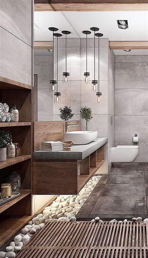 A Modern Bathroom With Stone Flooring And Wood Accents