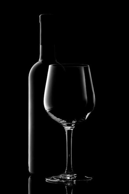 Premium Photo Red Wine Bottle And Wine Glass Isolated On Black Background
