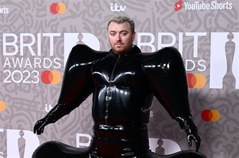 Sam Smith Stuns With Inflatable Latex Outfit On 2023 Brit Awards Red