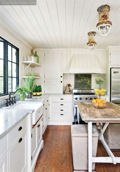 The dark, moody tile walls, sleek backsplash, and stainless steel appliances assert an undeniably glam to protect it from water damage, konig added an invisible glass over the wallpaper between the counter and cabinets. 20 Amazing Beach Inspired Kitchen Designs | Interior God