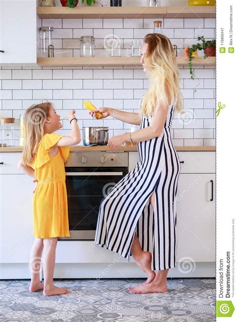 Picture Of Mother And Daughter Cooking In Kitchen Stock Image Image Of Daughter Mother 119868447