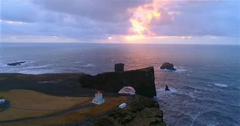 Aerial Sunrise Shot Of Dyrholaey In South Iceland Stock Video Footage