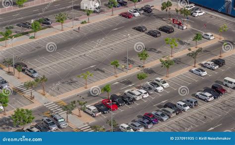 Top View Busy Parking Lot With Many Cars Moving In And Out Timelapse