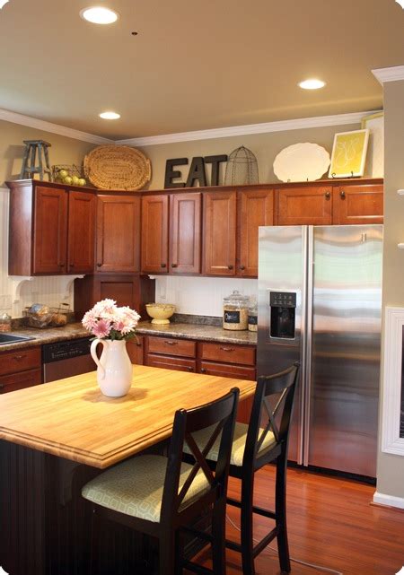 How To Decorate Above Kitchen Cabinets From Thrifty Decor Chick