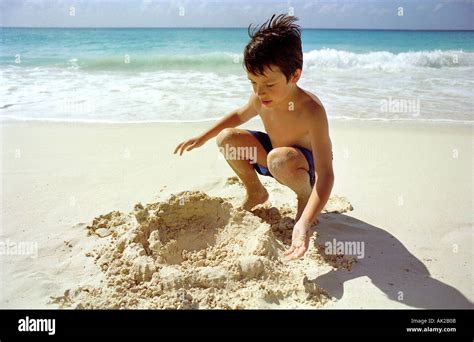 Boy Digging Big Hole In Sand Hi Res Stock Photography And Images Alamy