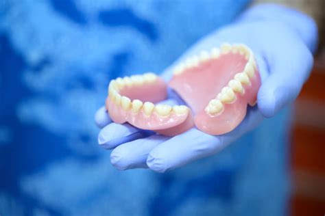 4600 Hand Holding Denture Stock Photos Pictures And Royalty Free