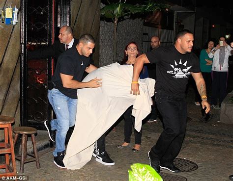 Justin Bieber Caught Sneaking Out Of Brothel Covered By Bedsheets In