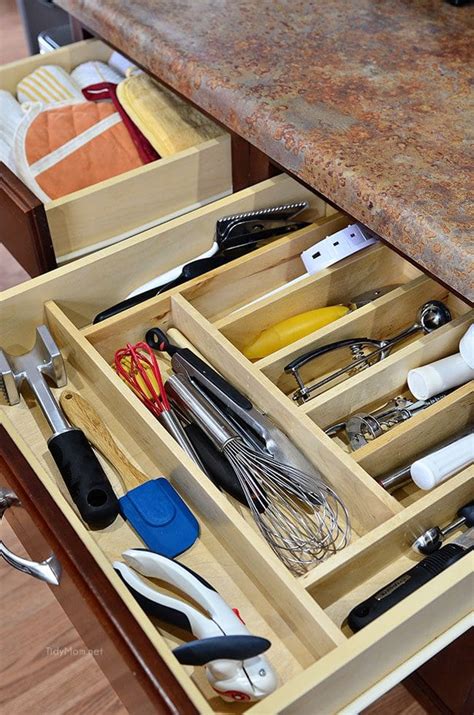 The filing cabinet drawer has to slide on a track, and sometimes the drawer can fall down below the track. Kitchen Drawer Organization | TidyMom
