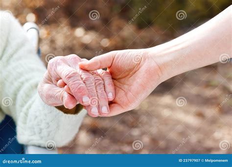 Senior Lady Holding Hands With Young Caretaker Stock Image Image Of