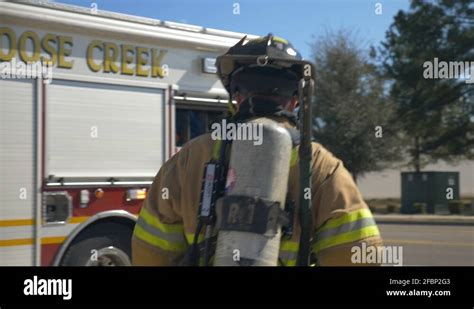 Firefighter Walking Towards Firetruck After A Firefighting And Rescue