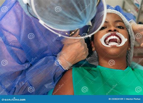 Female Dentist Treating Patient In A Dental Office Stock Image Image