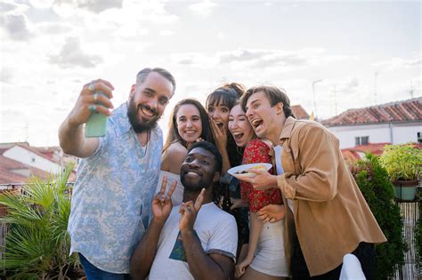 Group Of Friends Taking A Selfie Outdoors By Stocksy Contributor Luis Velasco Funny