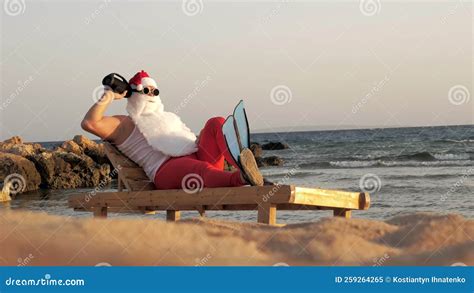 Santa Claus Sunbathes Funny Santa Claus In Sunglasses And Flippers