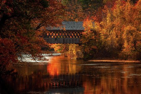A Covered Bridge In Fall Colors Photograph By Jeff Folger