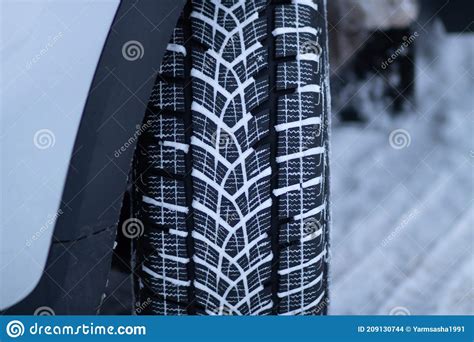 Winter Tire Tread On A Snow Covered Road Driving On Winter Tires On A