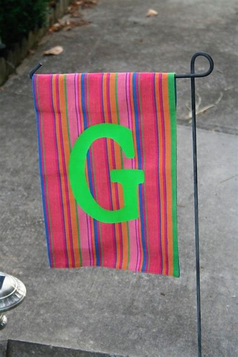 Measure your material against the flagpole. DIY Garden Flags for Every Season - Pretty Handy Girl