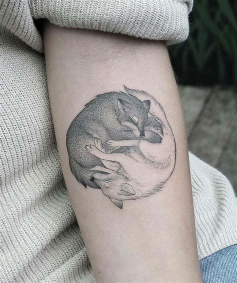 Yin yang tattoos can be worn in any part of the body. Wolf Tattoos - Tattoo Insider