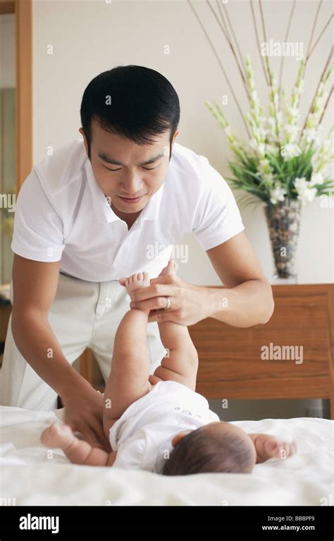 Father Changing Babys Diapers Stock Photo Alamy